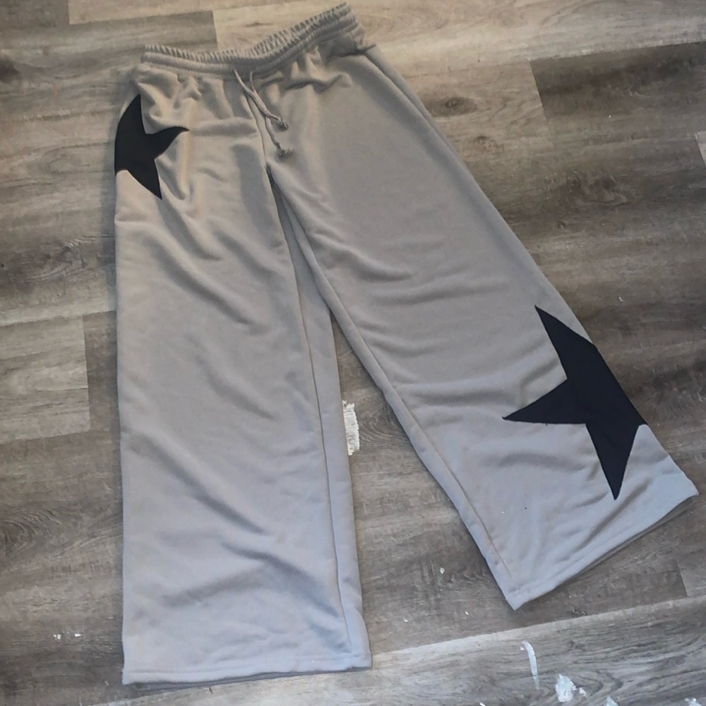 grey sweatpants with black stars
